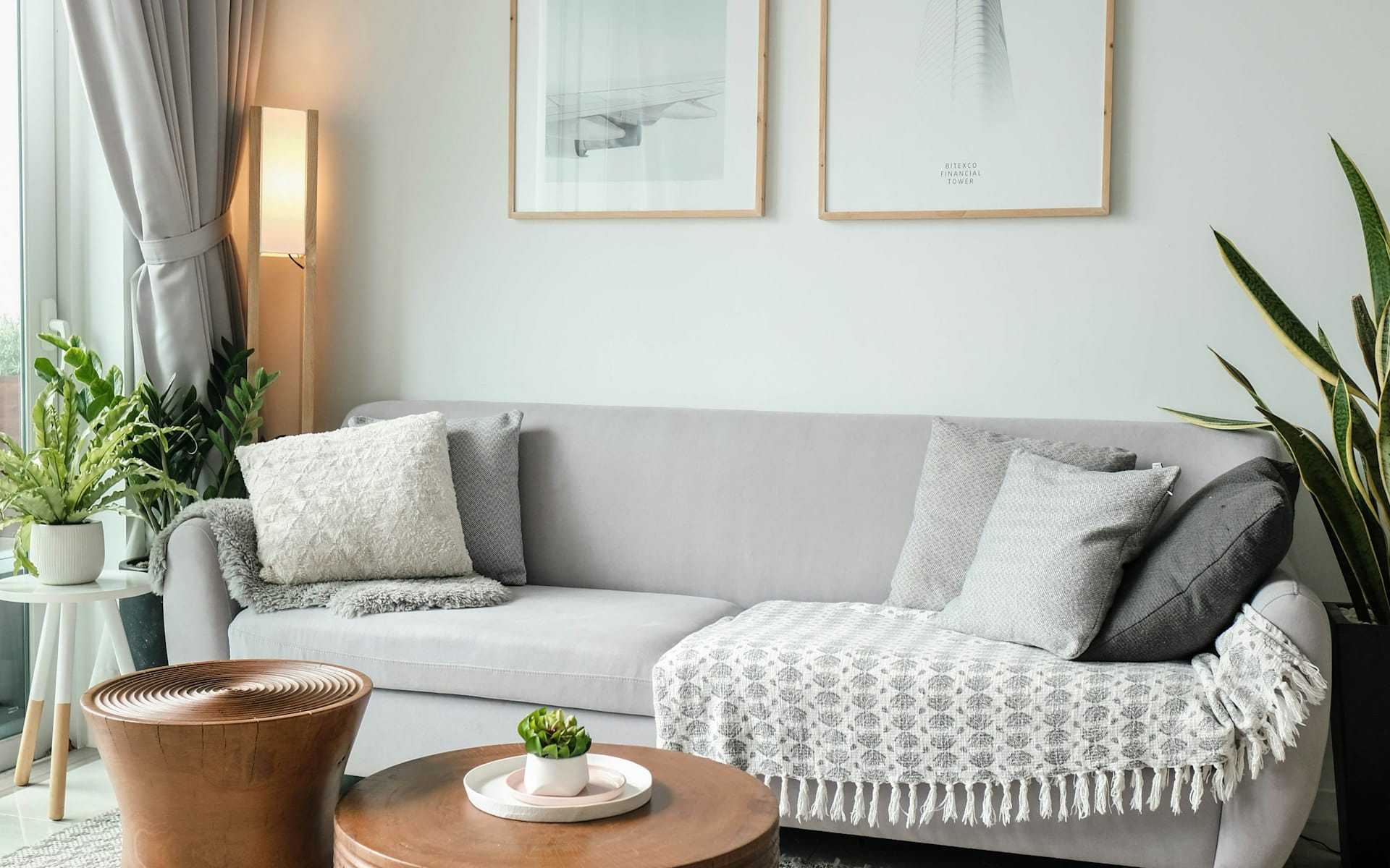 Modern UK living room with a professionally installed wall-mounted air conditioning unit
